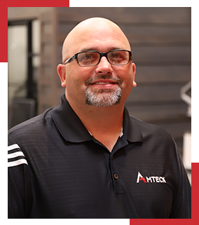 Bald man with glasses smiling