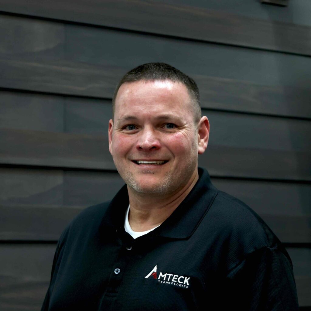 headshot of veteran in amteck polo