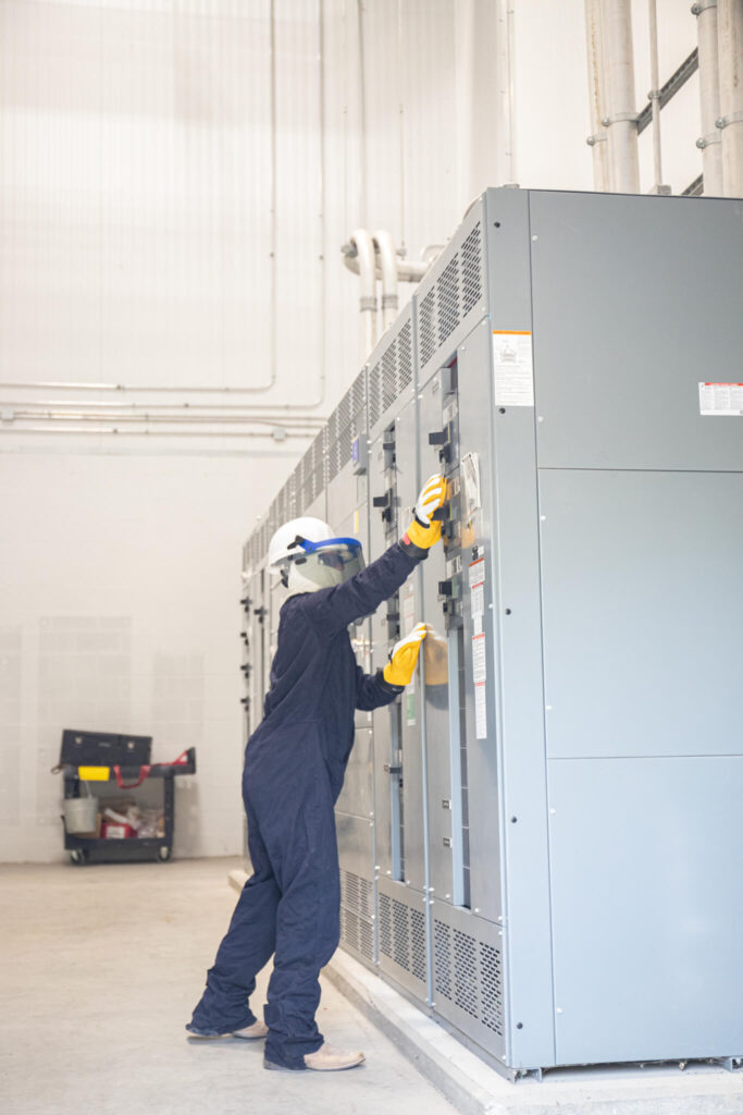 Electrician doing switch gear maintenance